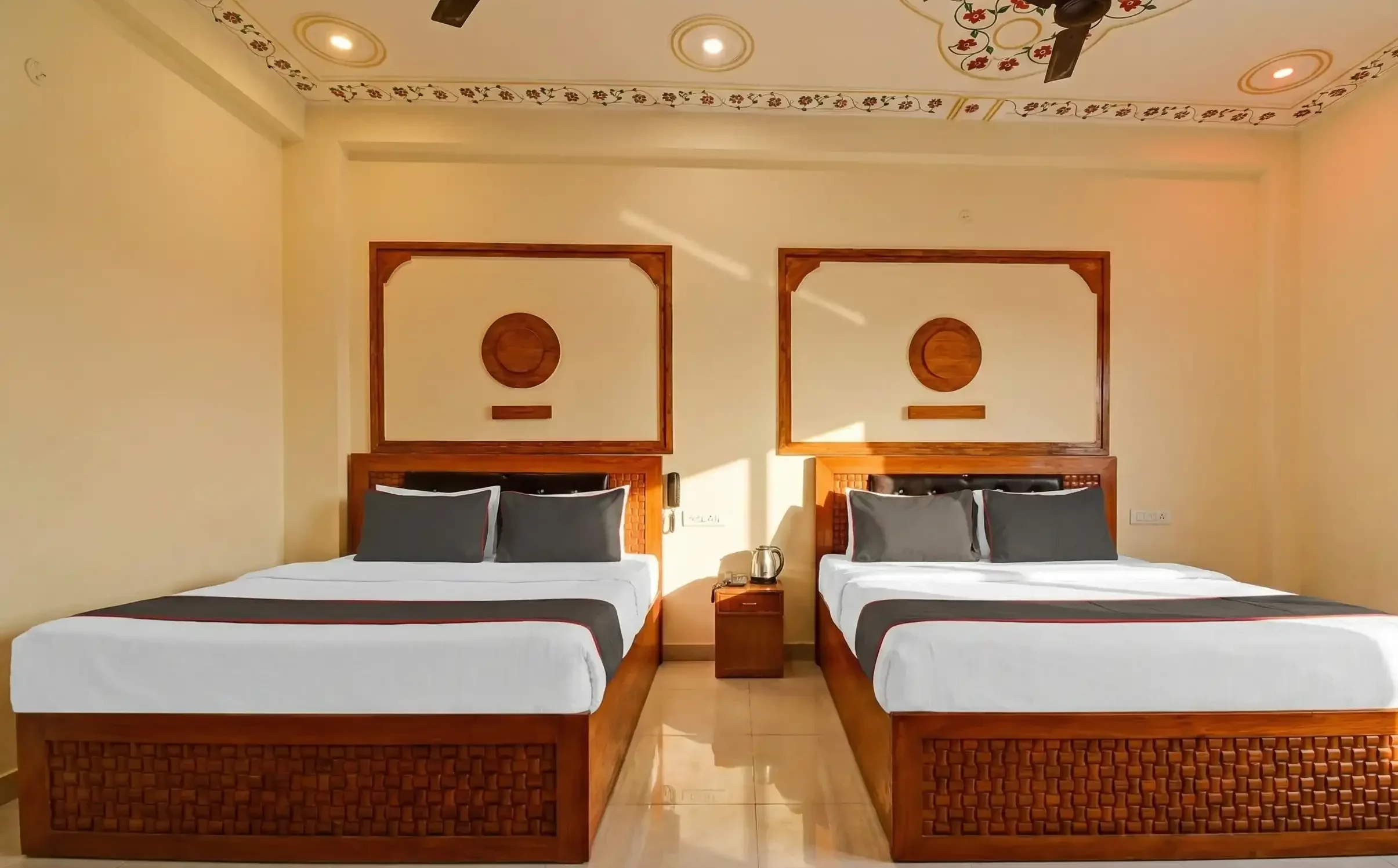Spacious Family Room at Hotel Imperial Palace Jaipur near Hawa Mahal with multiple beds.